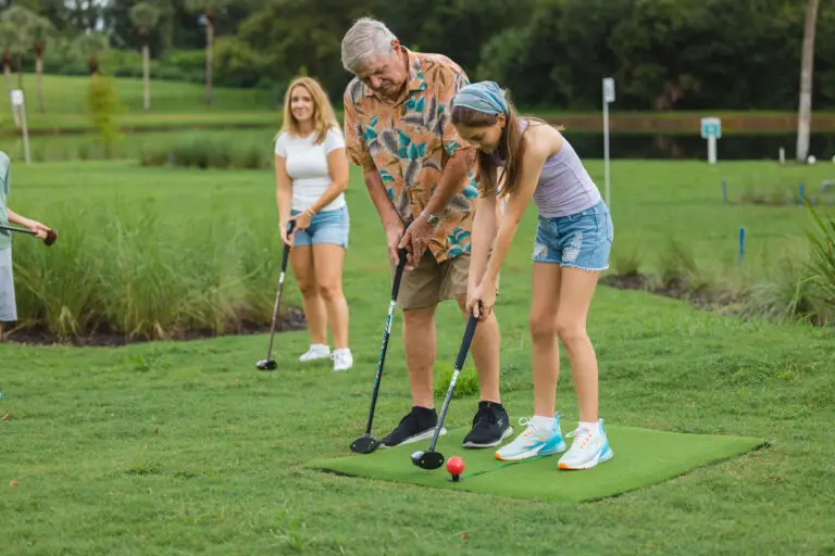 Family enjoying park golf at the new park golf club - 1 Club, s a symbol of park golf sport.