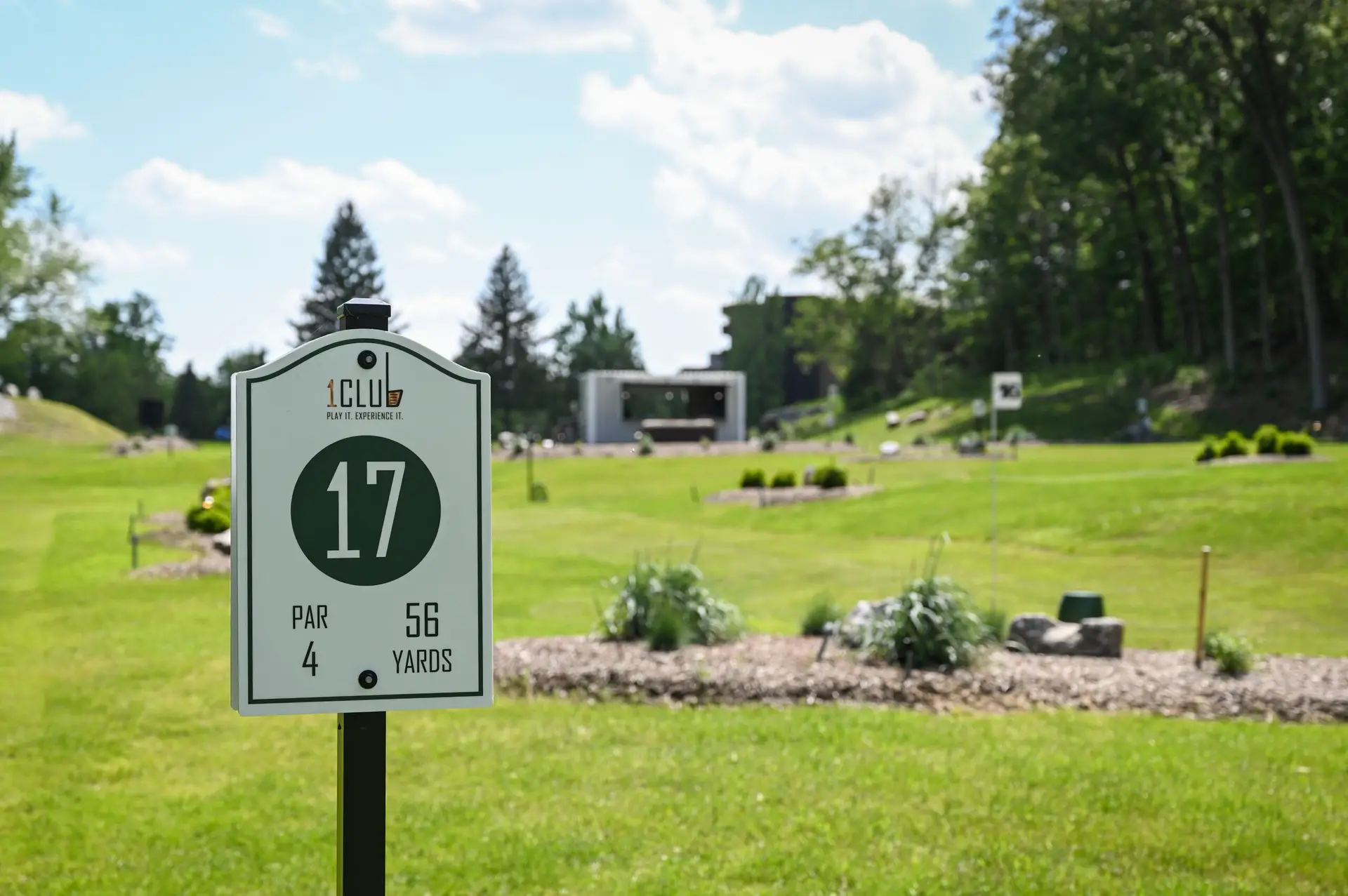 Park golf hole banner at 1Club Vernon, NJ showing yards and par, set against the scenic greenery of Vernon Valley.