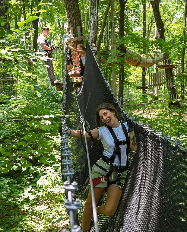 young woman at TreEscape New Jersey on a hight rope course