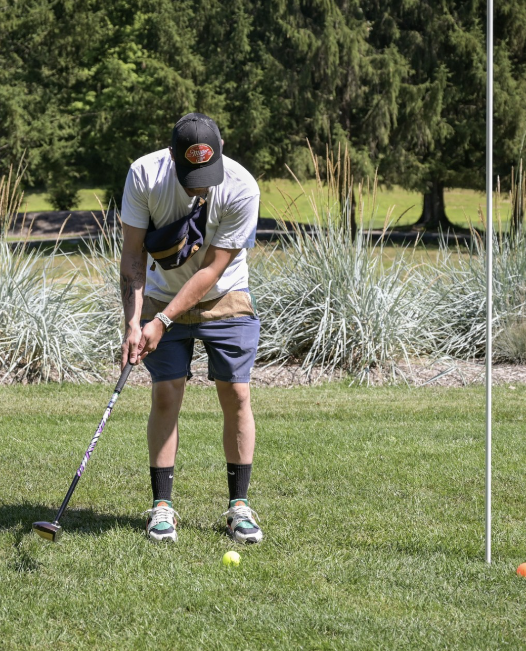 young man playing park golf at 1Club