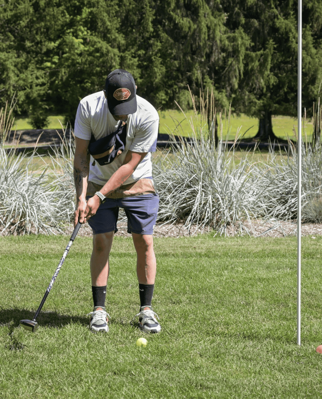 young man playing park golf at 1Club